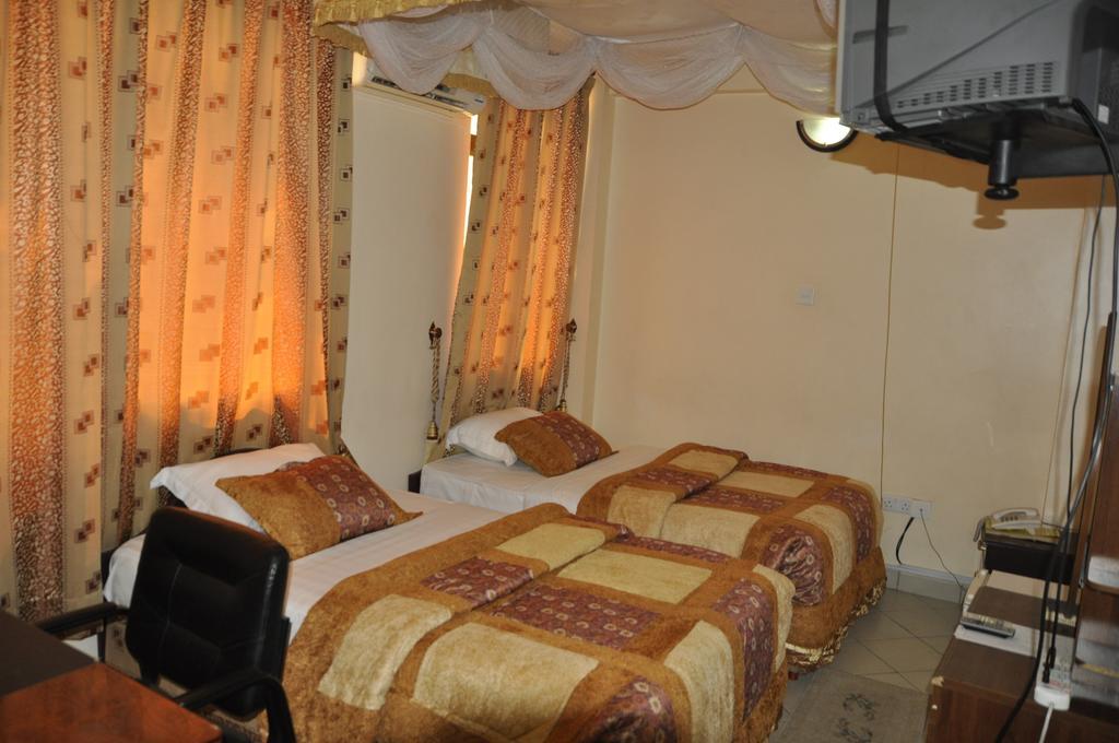 Rich Hotel Аруша Номер фото
