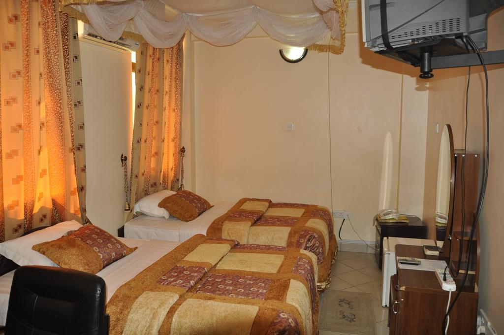 Rich Hotel Аруша Номер фото
