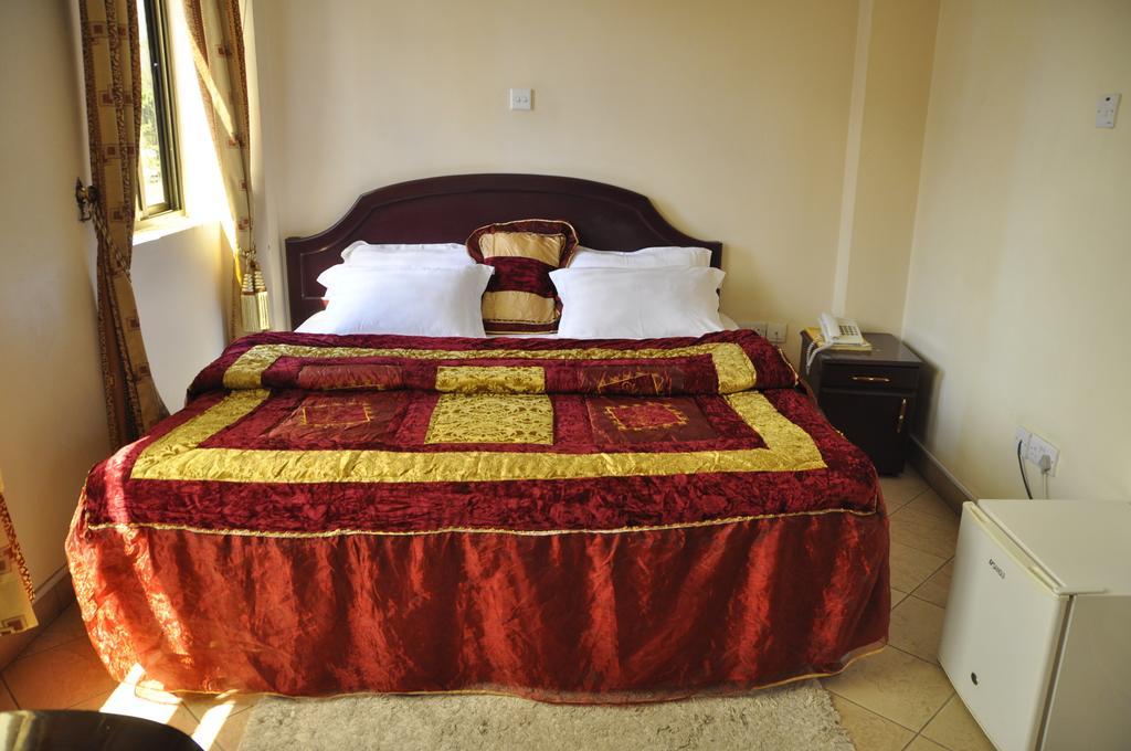 Rich Hotel Аруша Номер фото